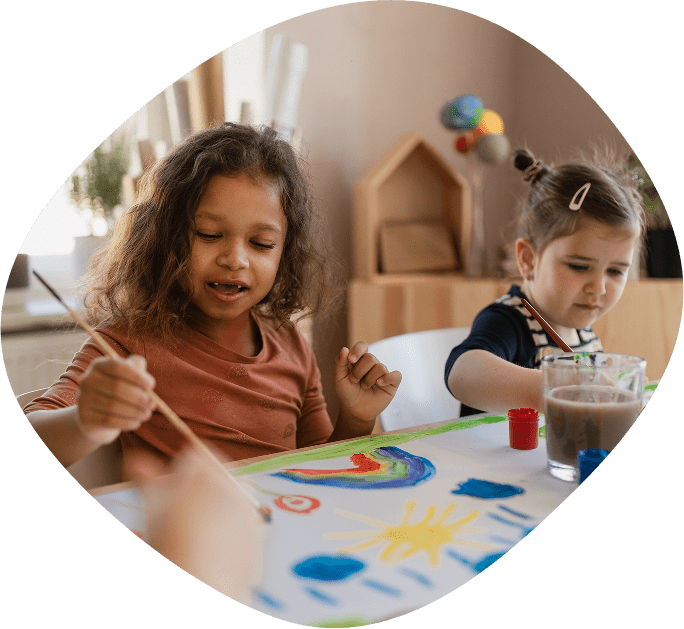 Children painting in classroom