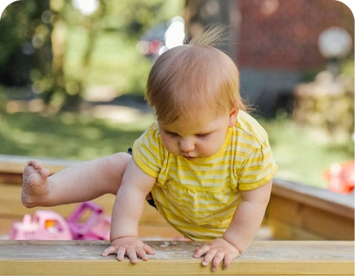 Baby in outdoor play area