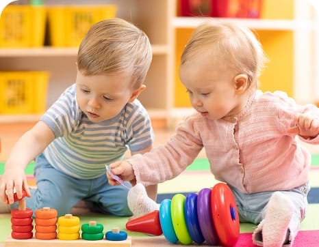 Toddlers playing with blocks
