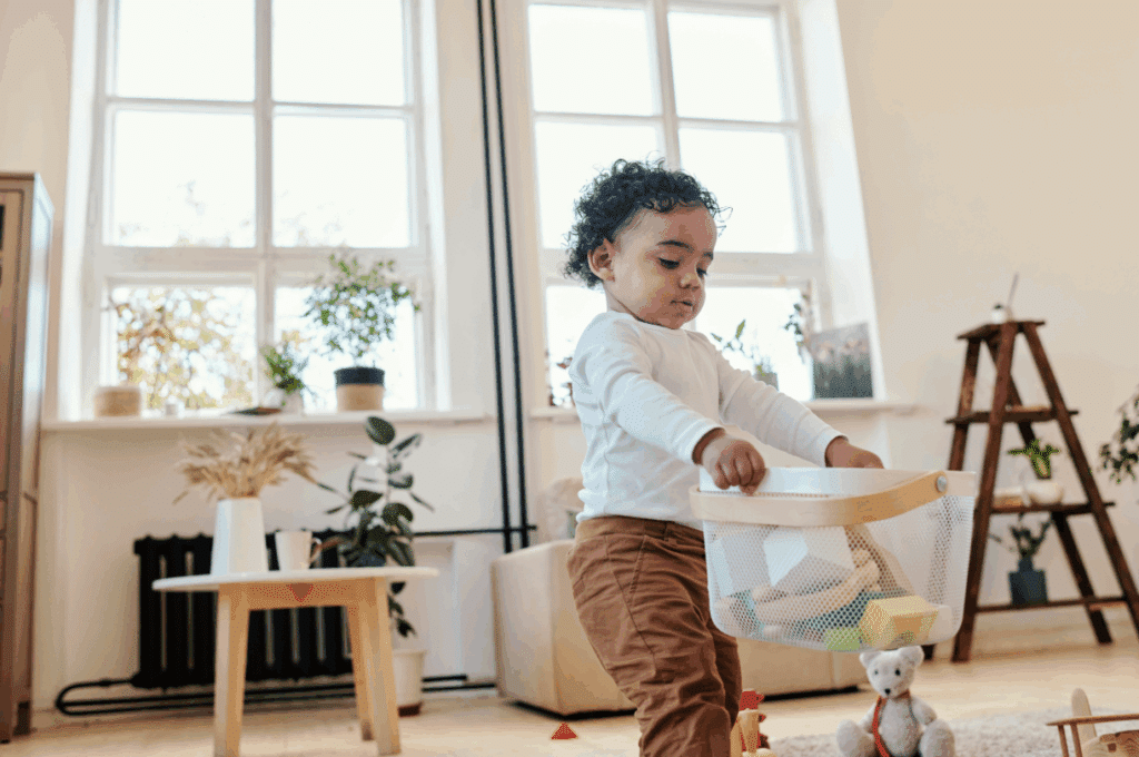 Child carrying a basket of toys