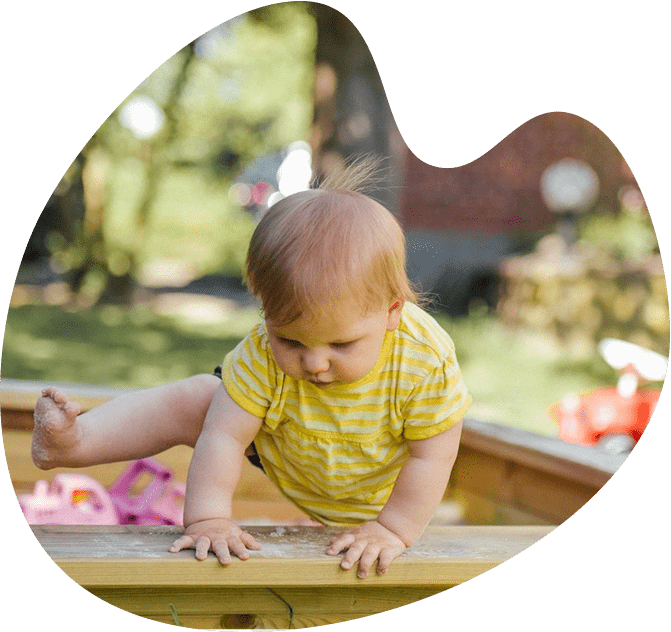 Baby in outdoor play area