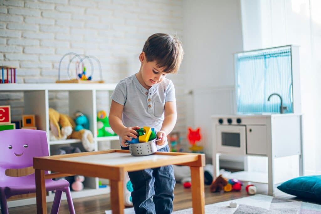 Child playing with toys in classroom