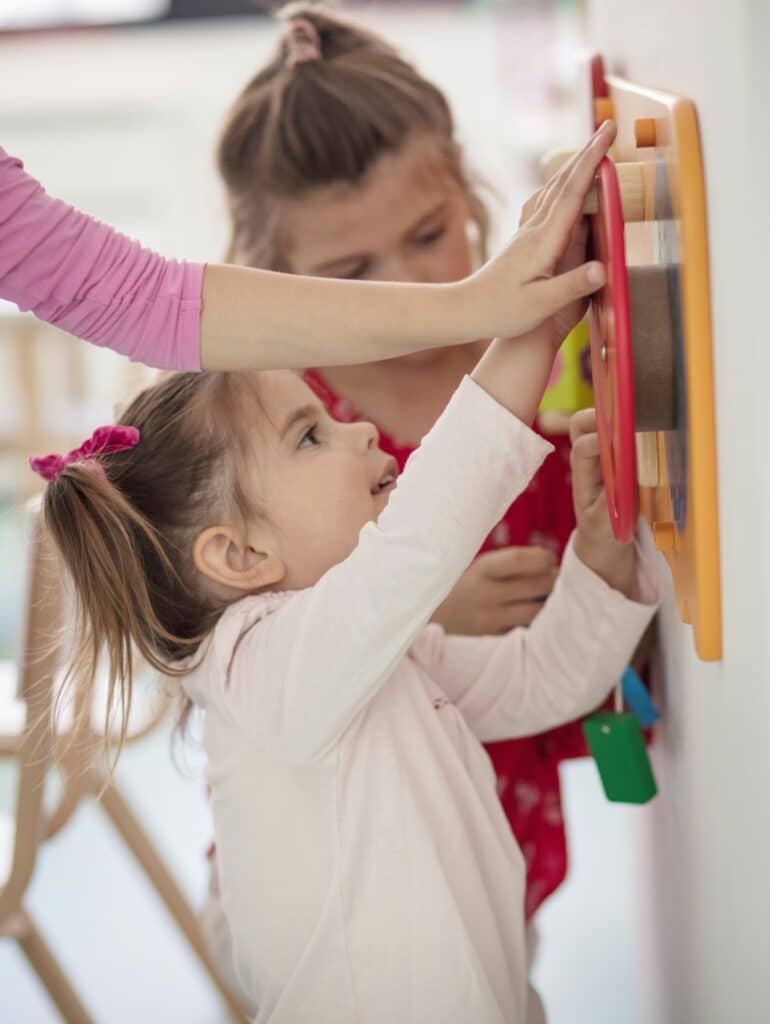 Educator and child engaged in learning