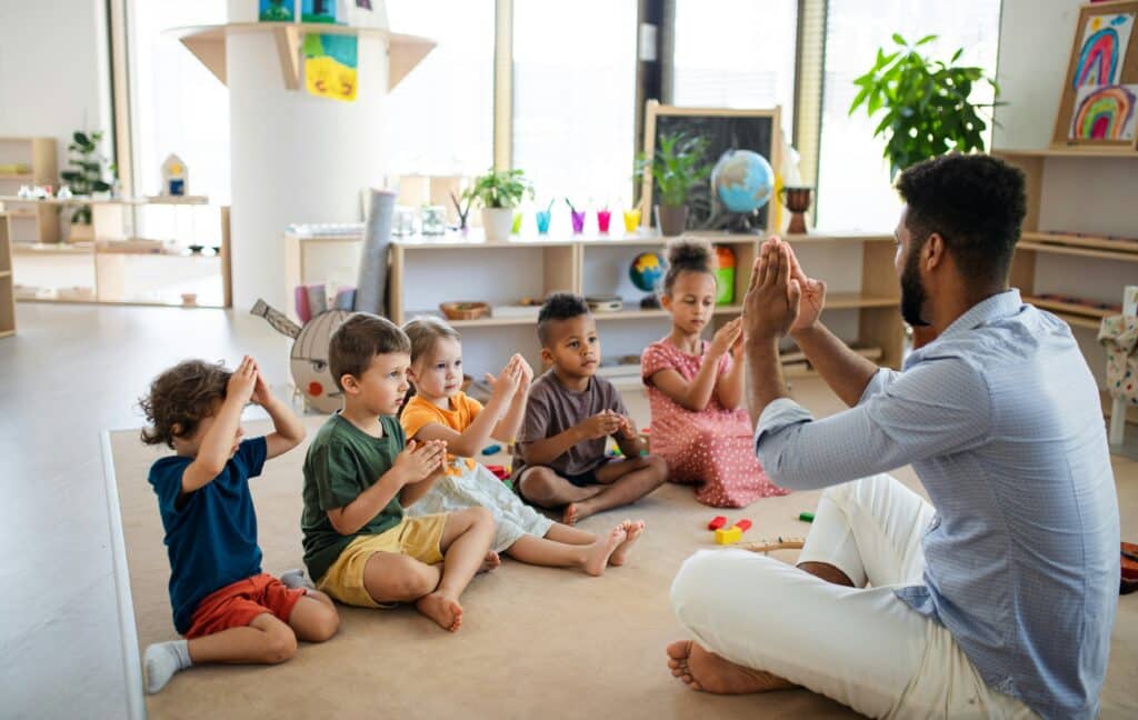Children in a group activity with educator