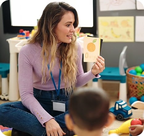 Educator and child reading.